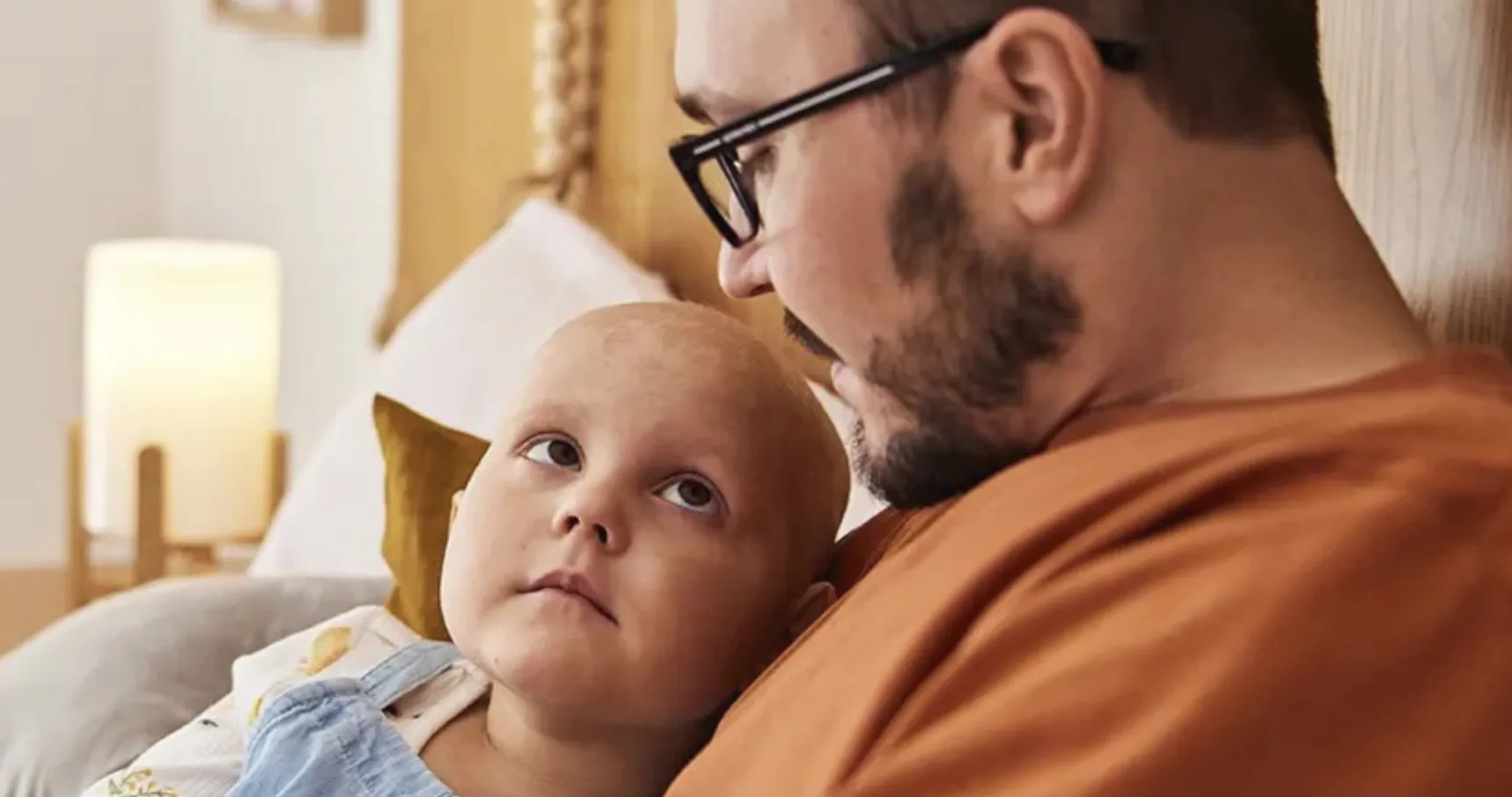 A father with her daughter looking at each other